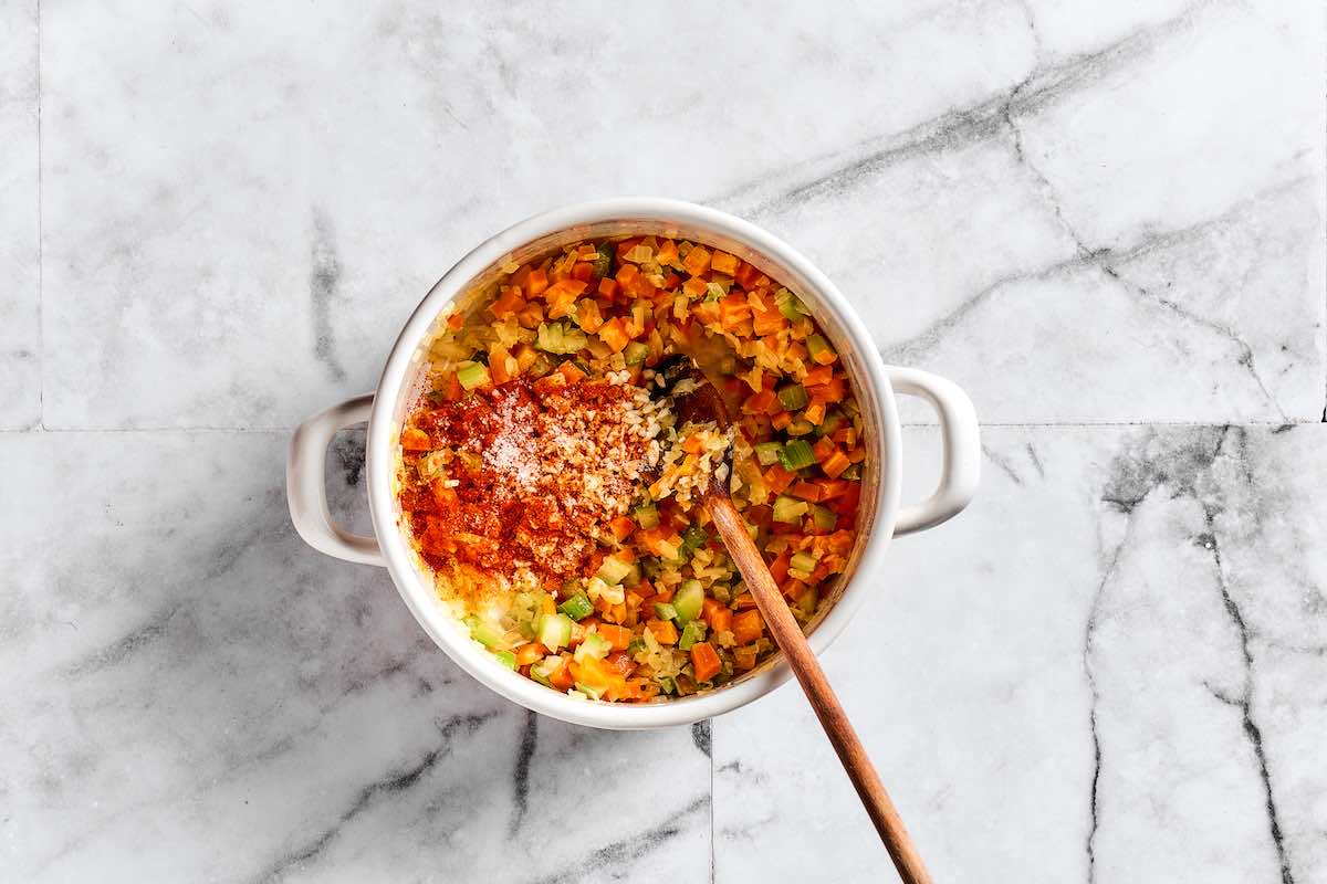 spices and vegetables in a saucepan.