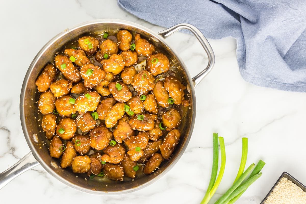 sesame chicken sauce tossed through deep fried and battered chicken.