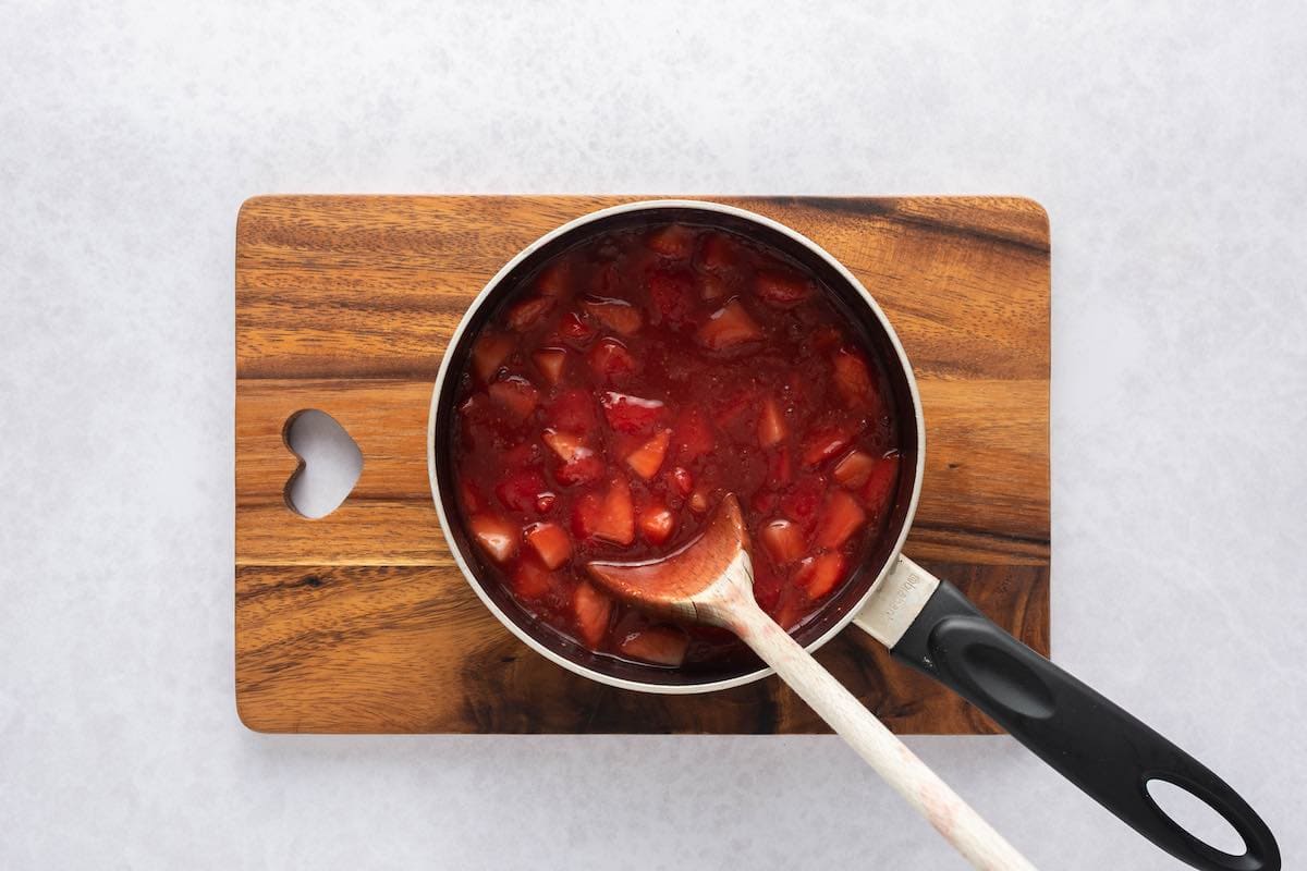 Strawberry topping in saucepan.