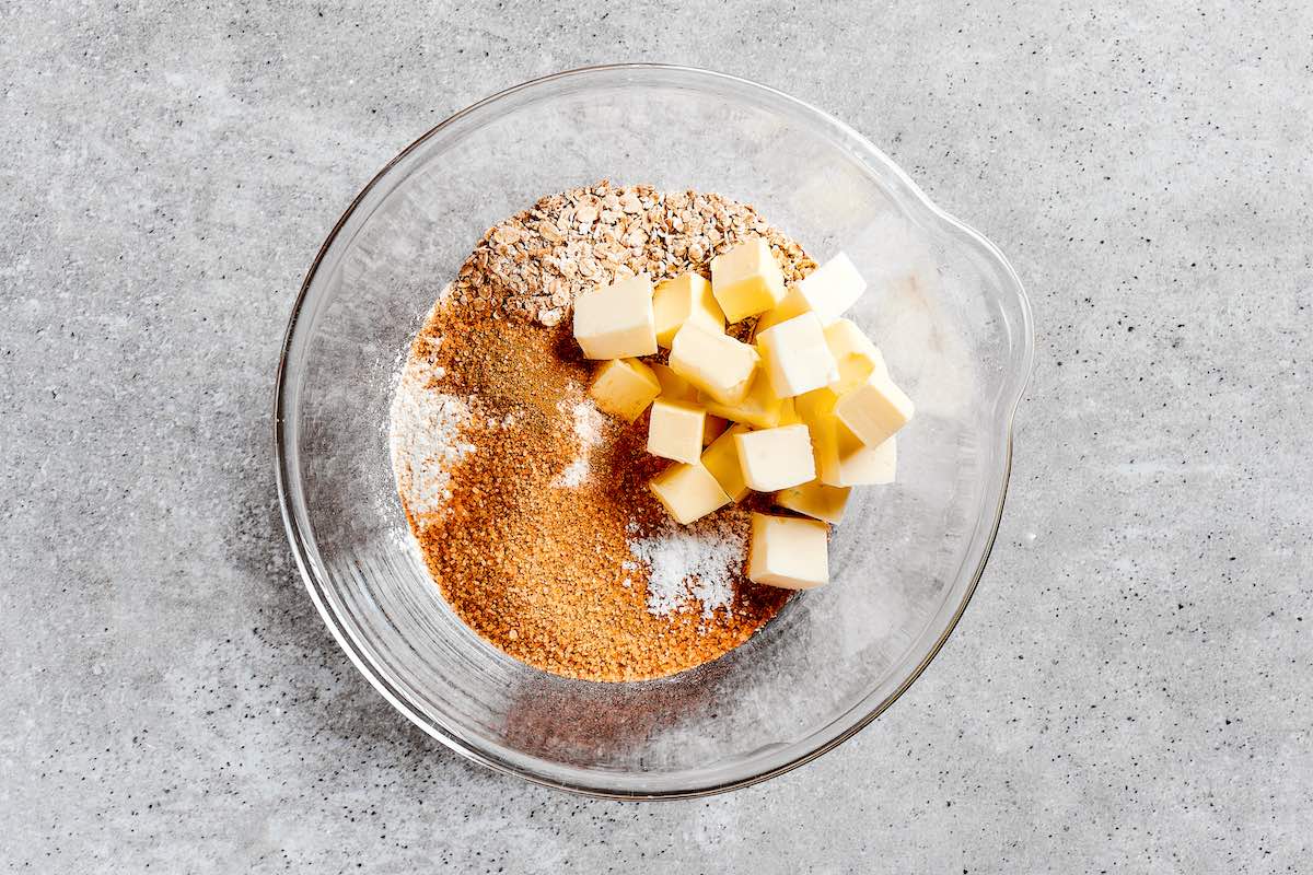 butter, oats, flour, and sugar in a bowl.