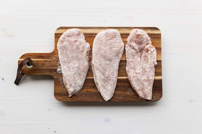 seasoned raw chicken breasts.