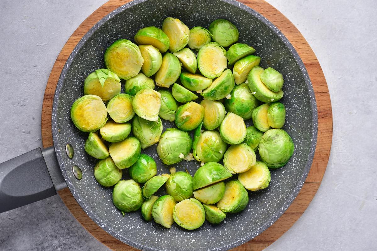 raw brussels sprouts in a skillet.