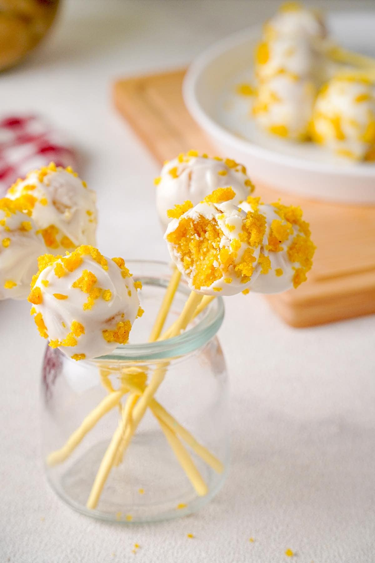 pumpkin cake pops in a glass jar.