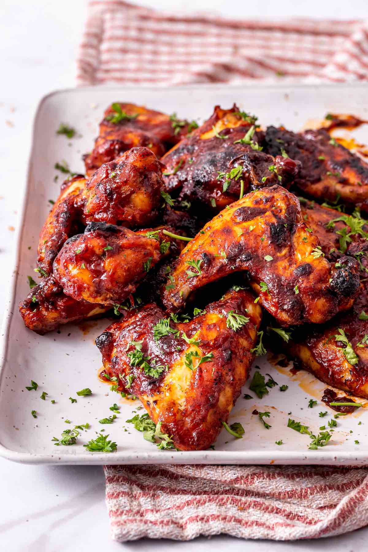 smoked chicken wings on a plate.