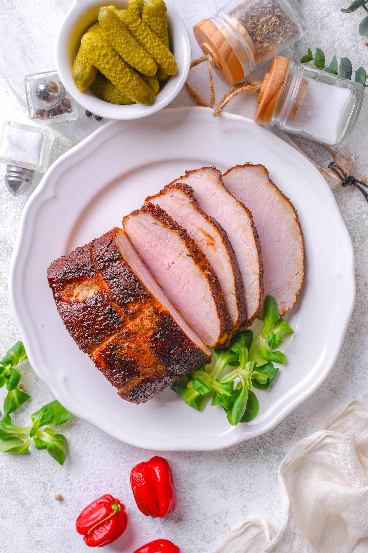 homemade smoked pork roast on a plate.