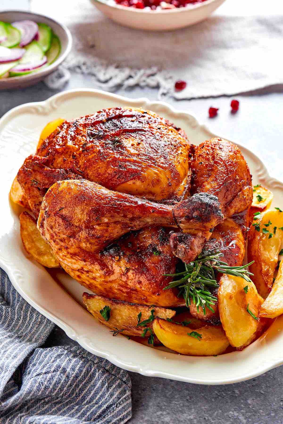 air fryer whole chicken with roasted potatoes.