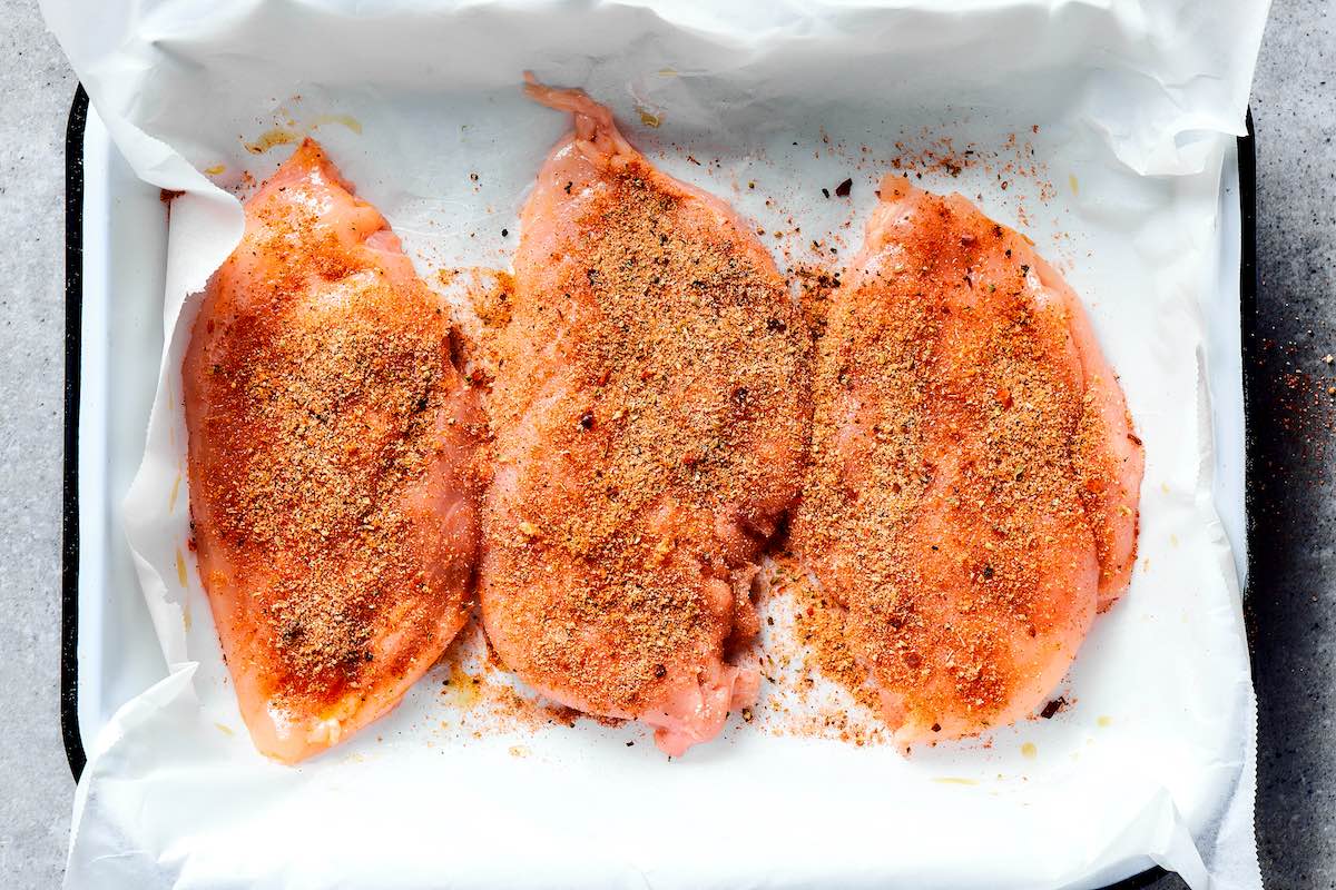 seasoned raw chicken breasts.