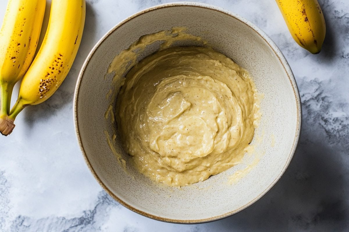 banana bread batter in a mixing bowl.