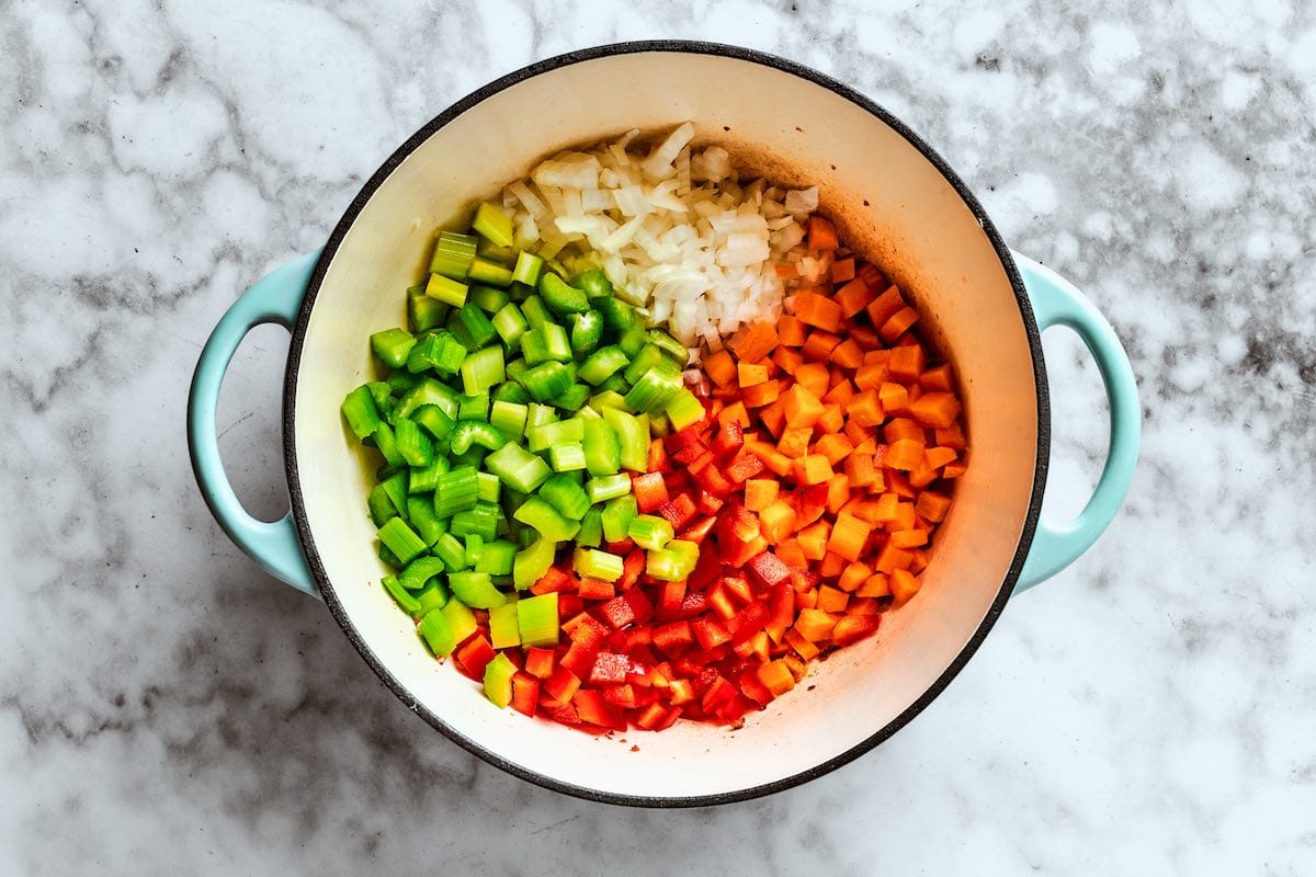 vegetables sauteing in soup pot.