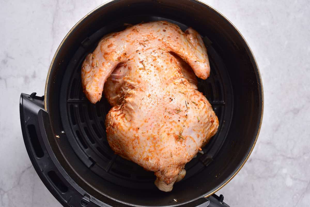 seasoned raw cornish hen in the air fryer.