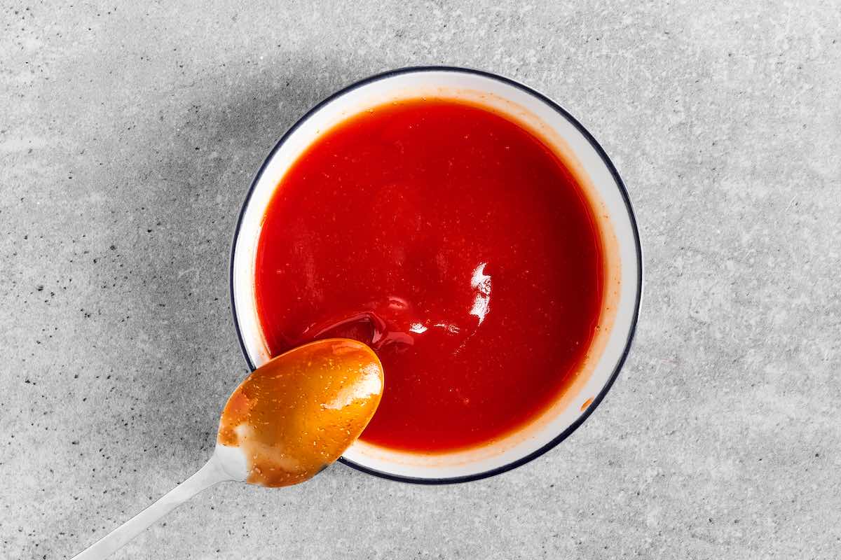 ketchup, apple cider vinegar, and brown sugar in a bowl.