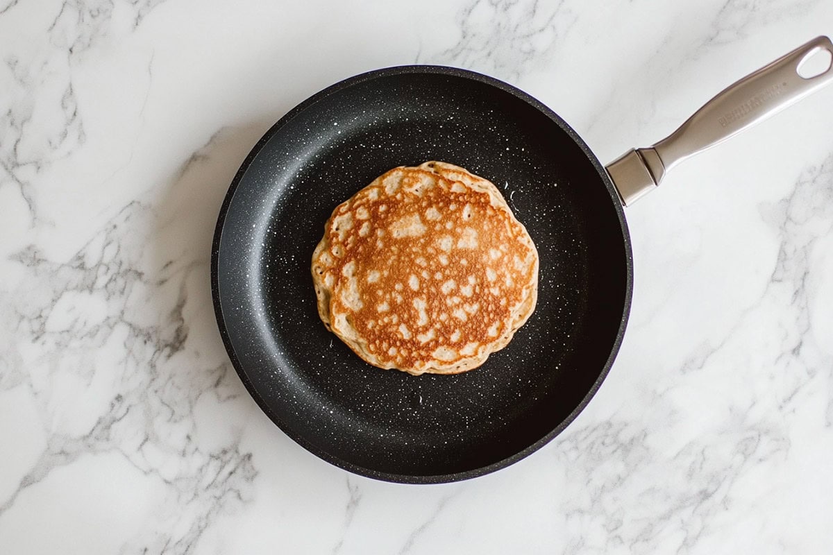 frying pancakes on a skillet.