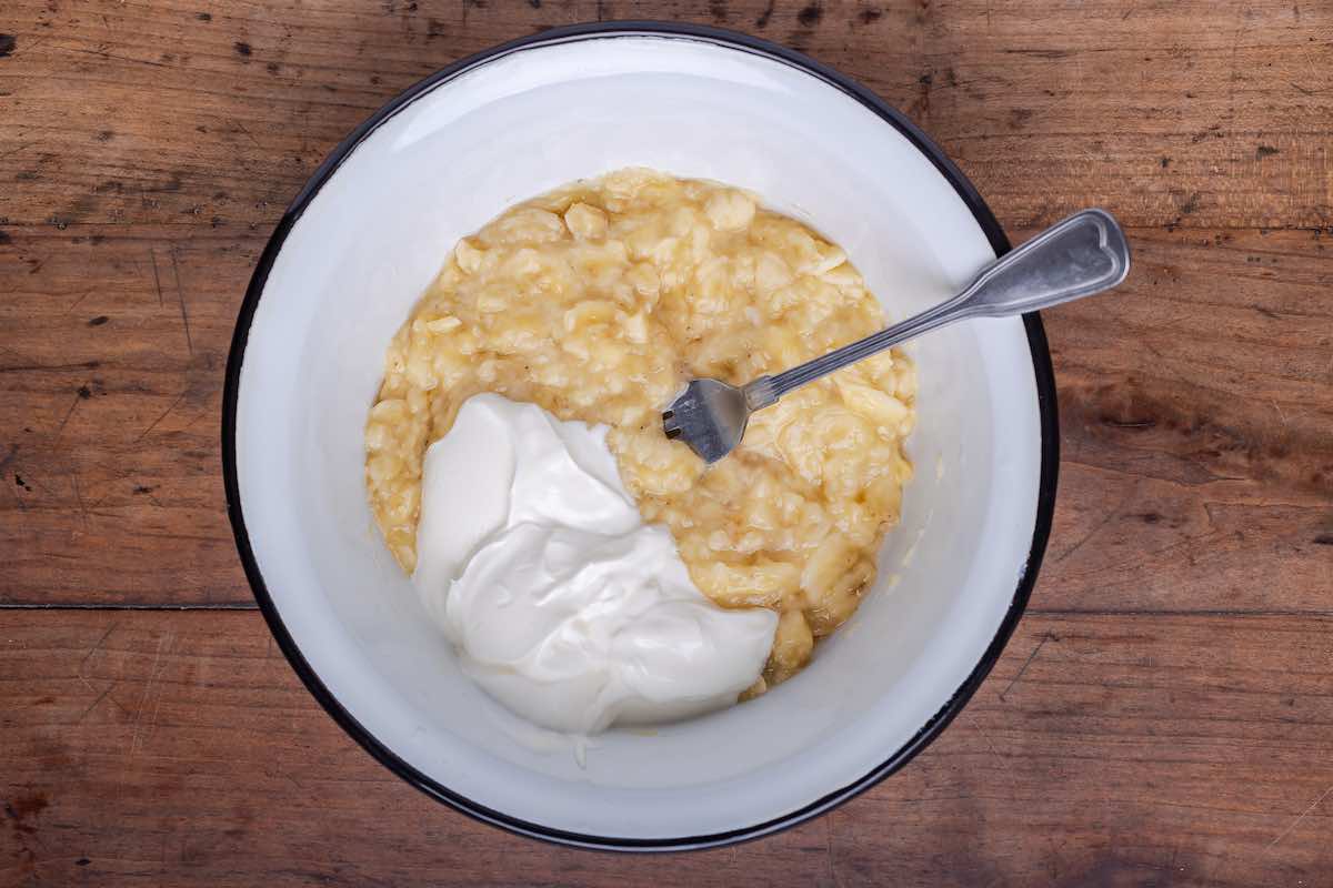 mashed bananas, coconut oil, and yogurt in a bowl.