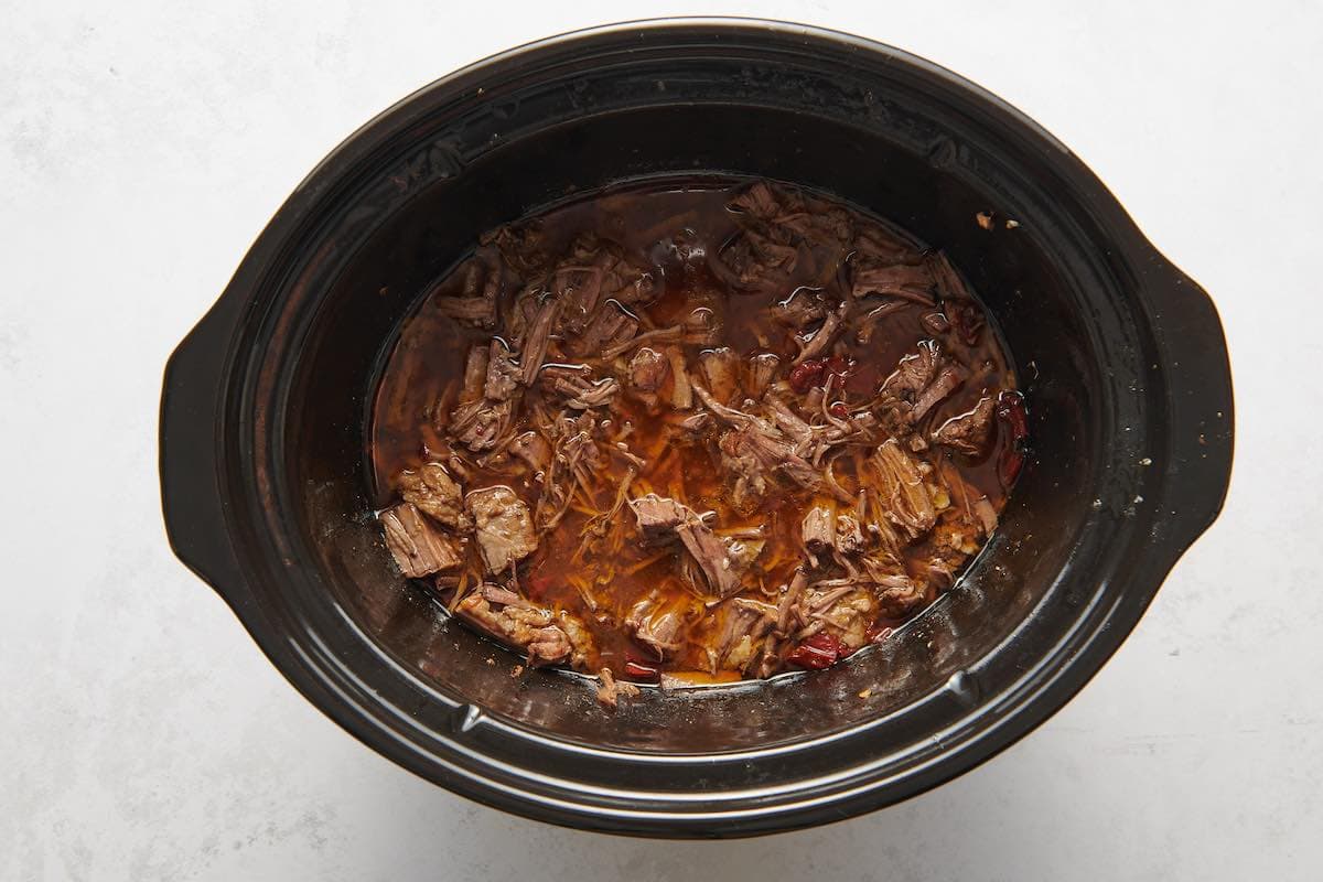 shredded beef in broth.