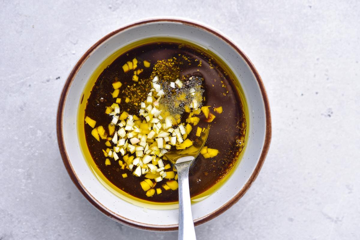 soy sauce, garlic, and aromatics in a bowl.