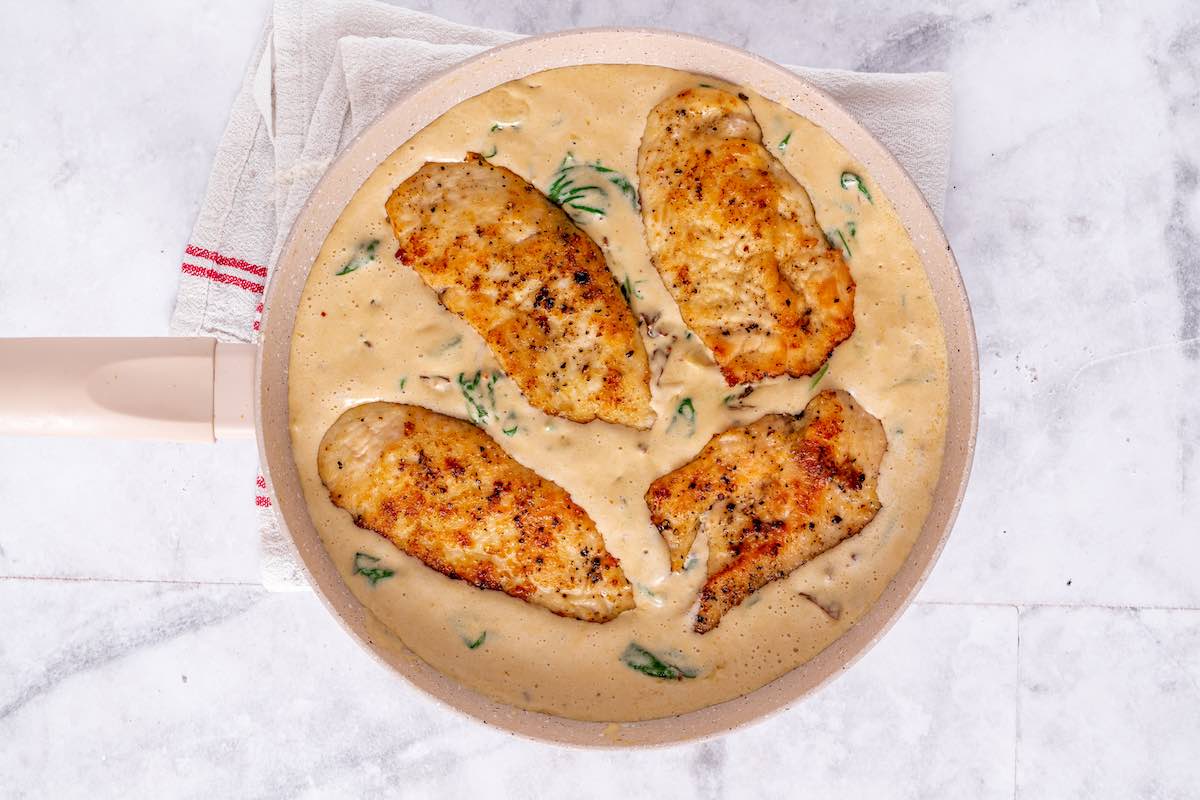 chicken added to creamy sauce.