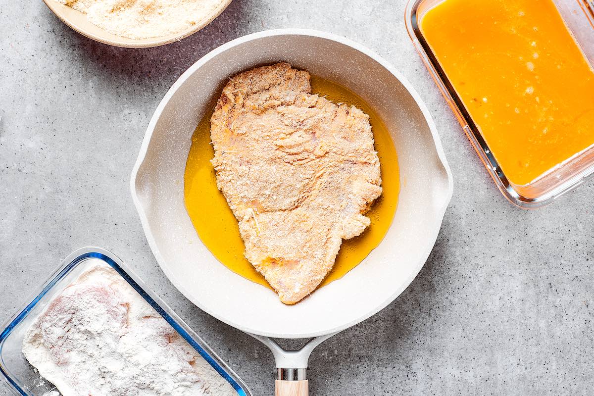 pan frying breaded chicken breasts.