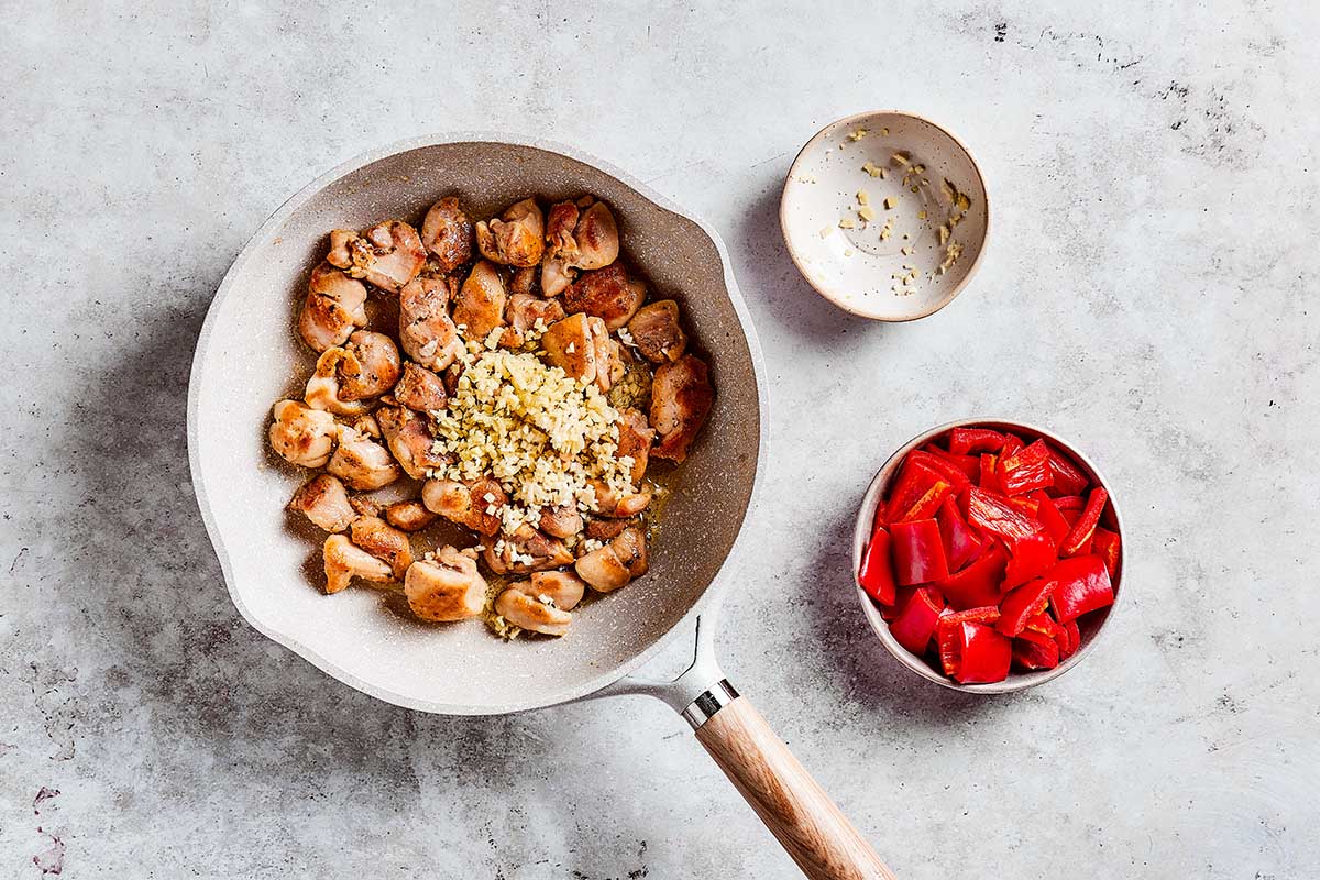 chicken and garlic in skillet.