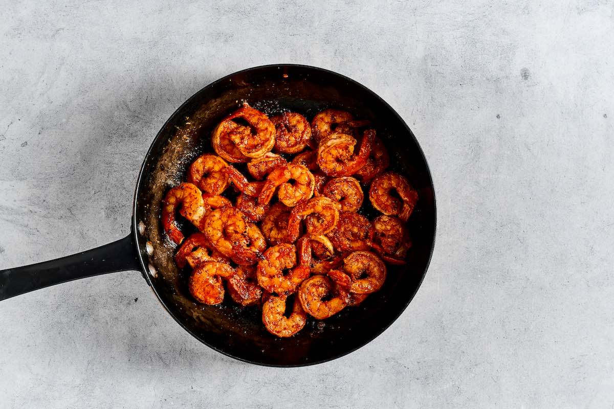 sauteing Mexican shrimp in a skillet.