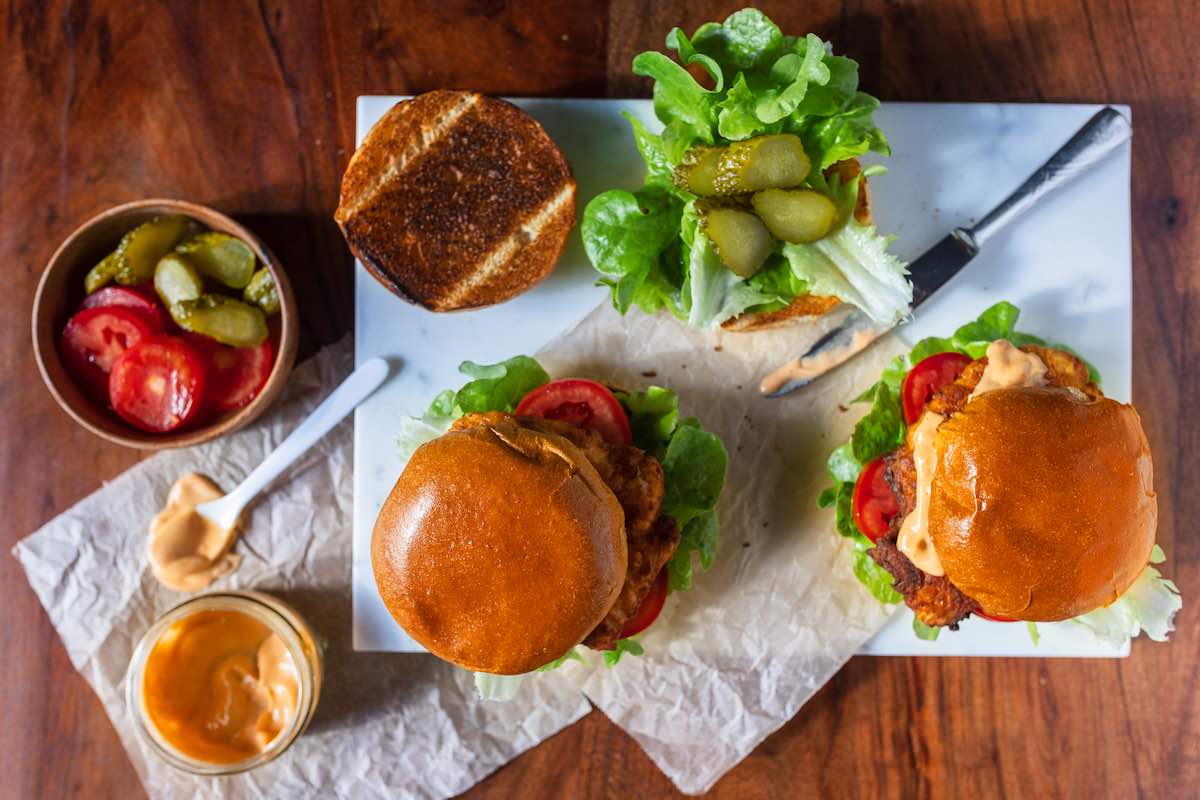 assembling chicken sandwiches.