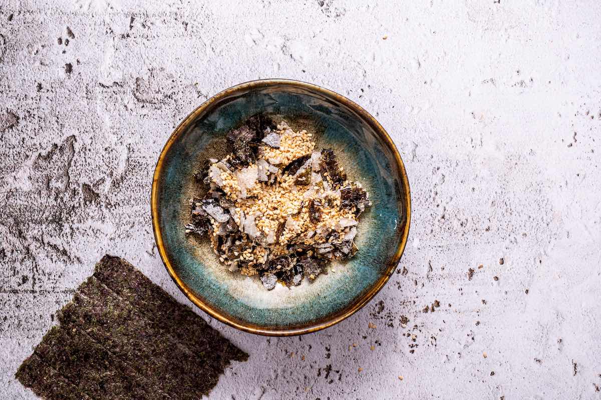 toasted sesame seeds with torn seaweed.