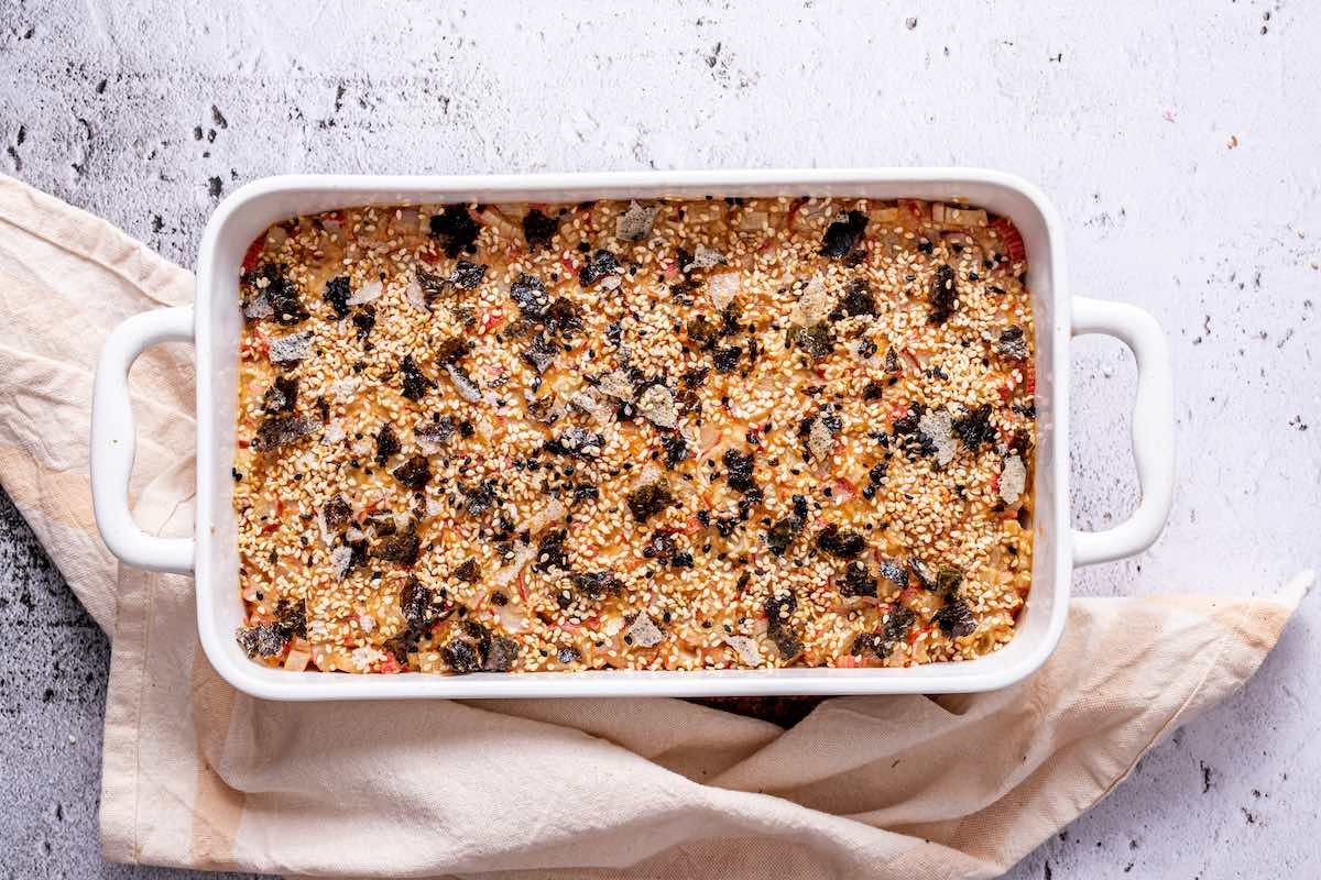 assembled sushi bake in a baking dish.