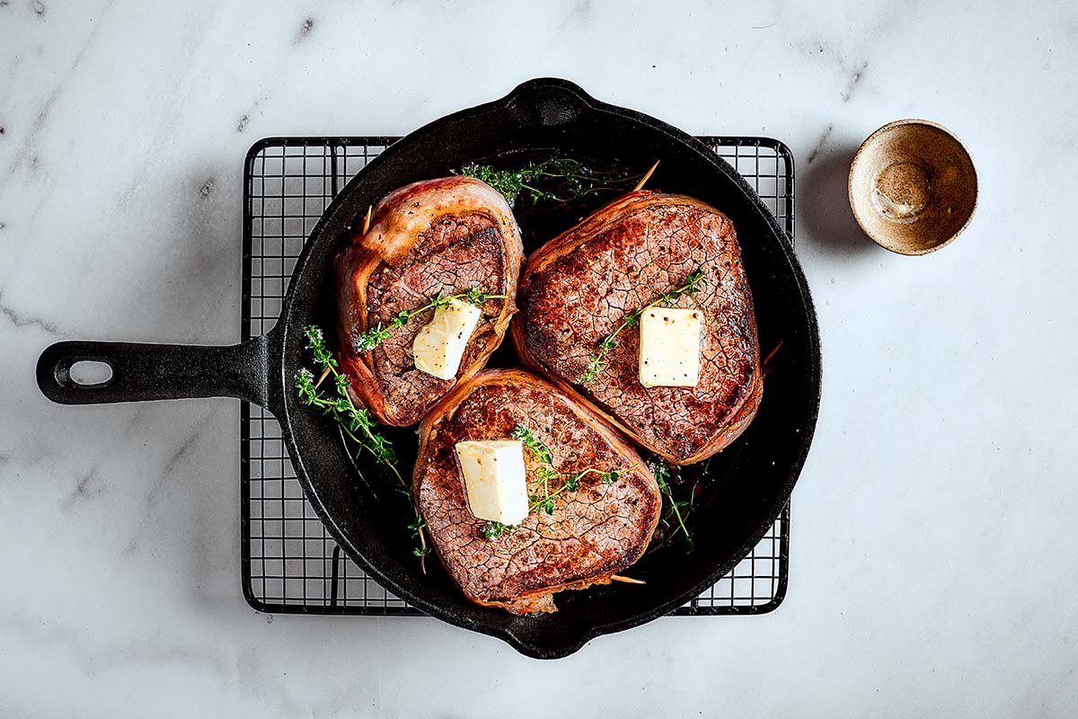 seared bacon wrapped filet mignon.