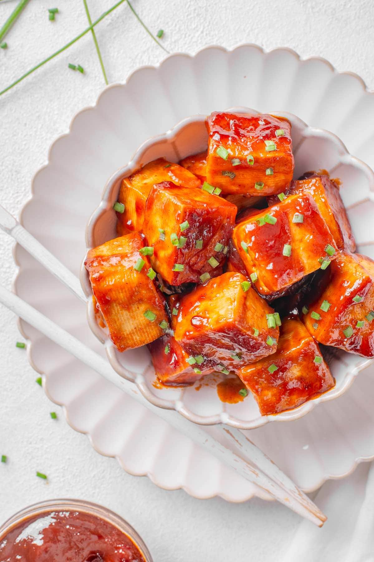 barbecue tofu with fresh herbs on top.