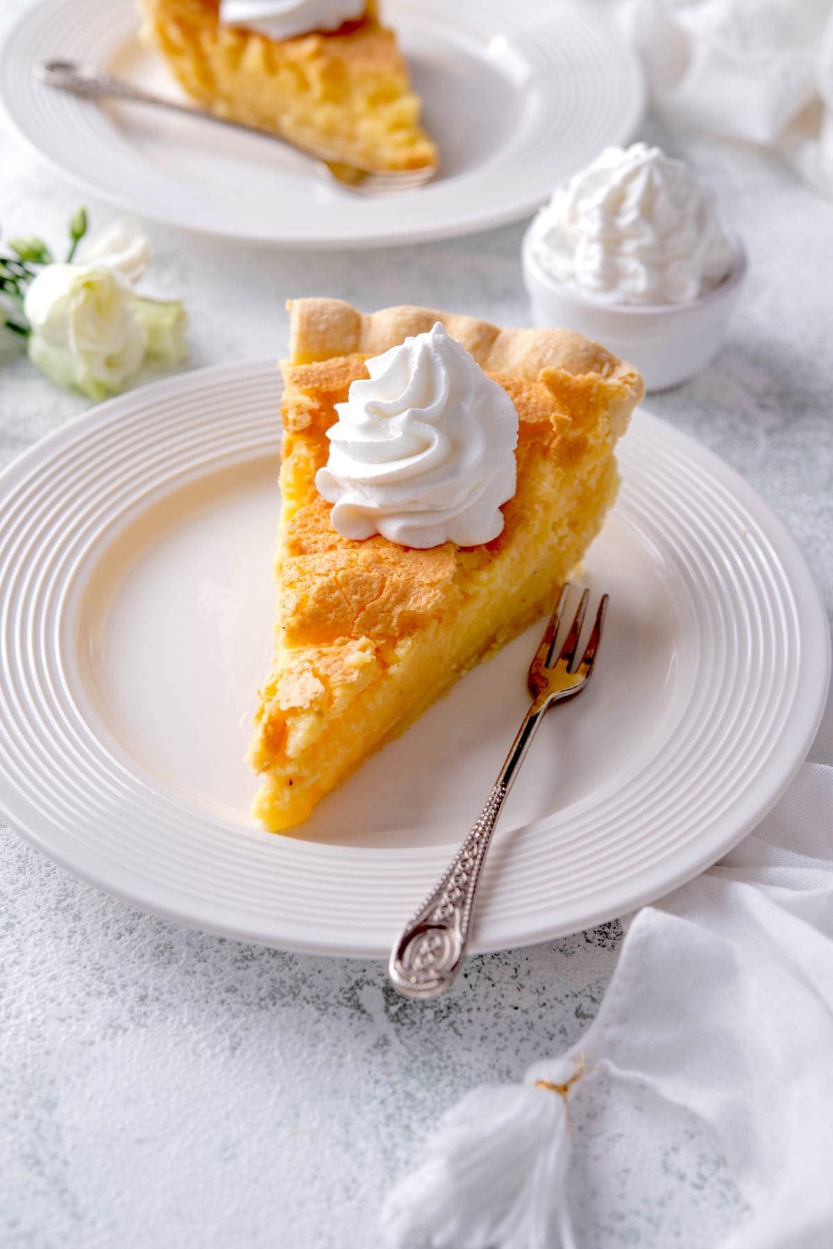 Southern buttermilk pie with whipped cream.