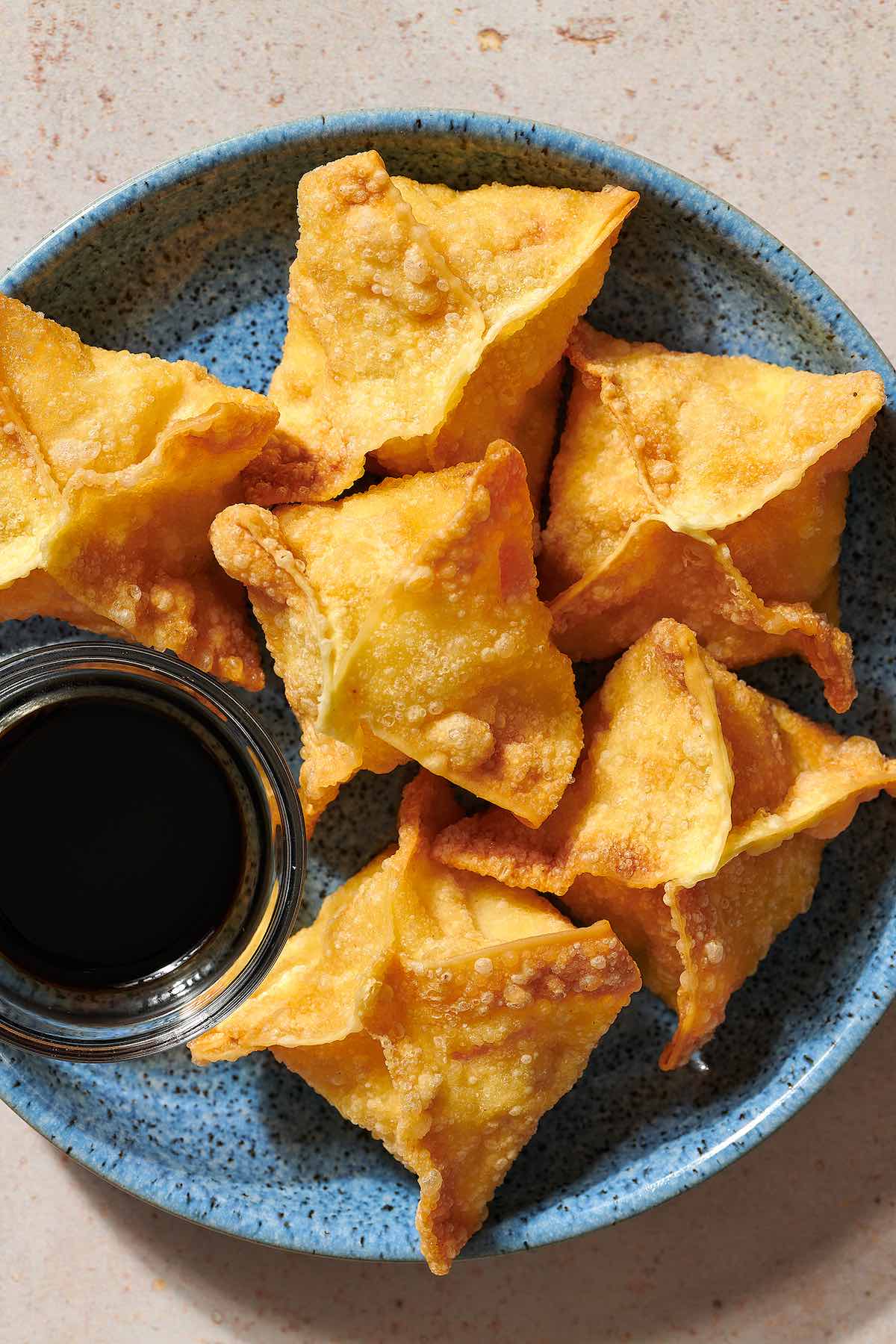 homemade crab rangoon with dipping sauce.