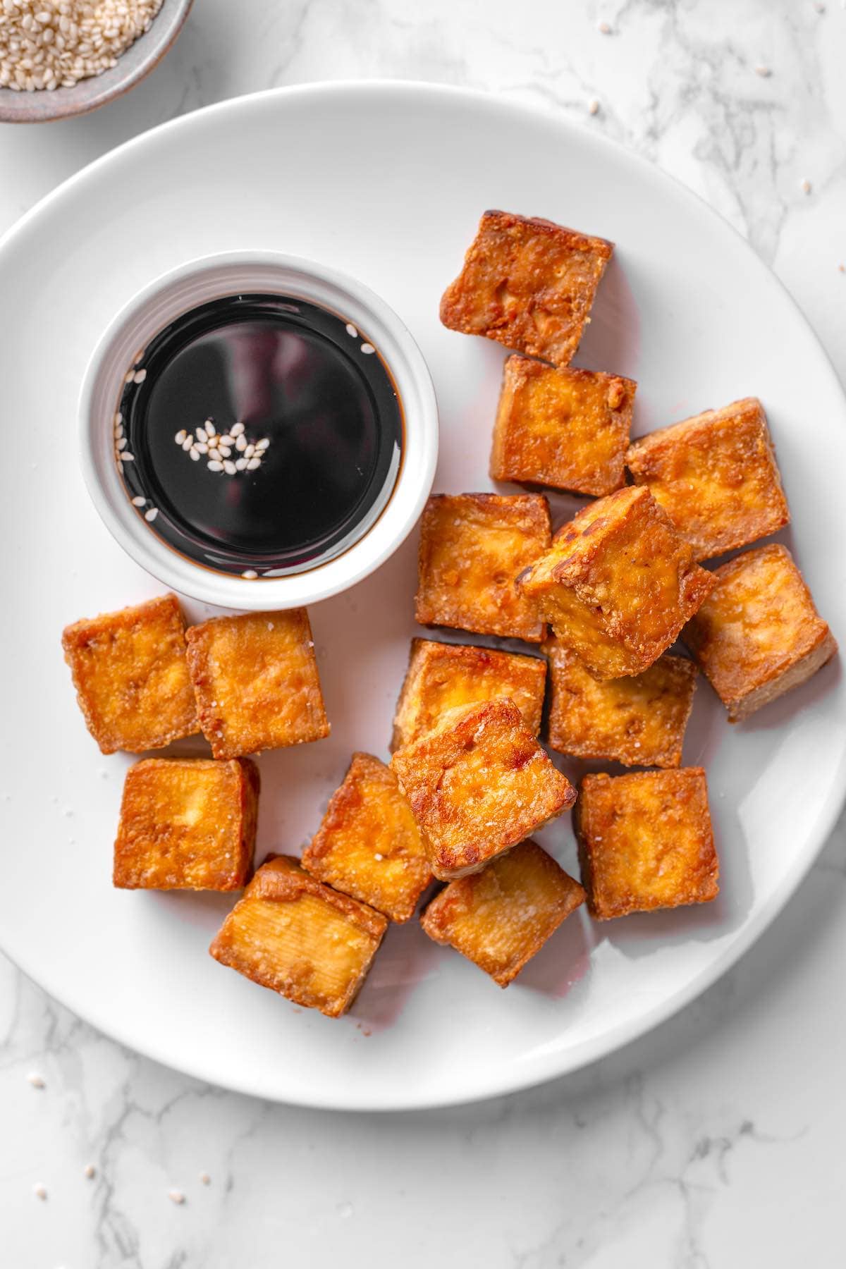 crispy baked tofu with dipping sauce.