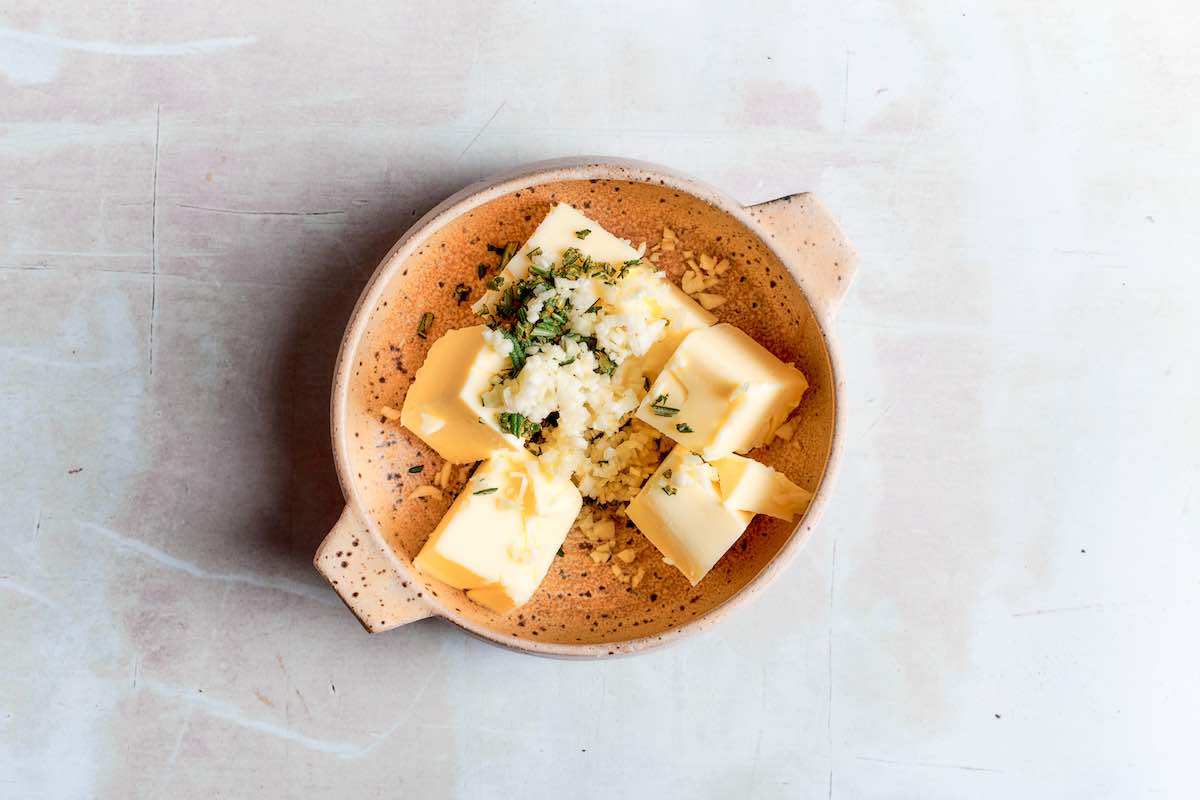 softened butter with garlic and fresh herbs.