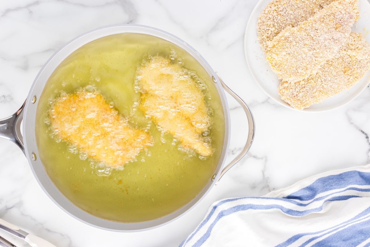 frying chicken cutlets in oil.