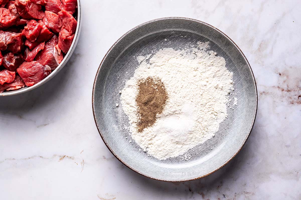 flour, salt, and pepper in a bowl.