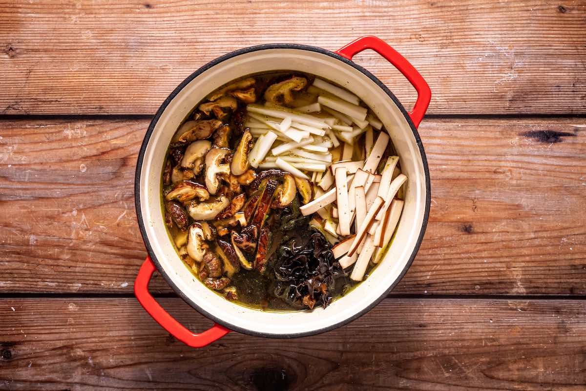 mushrooms and seasonings in broth.