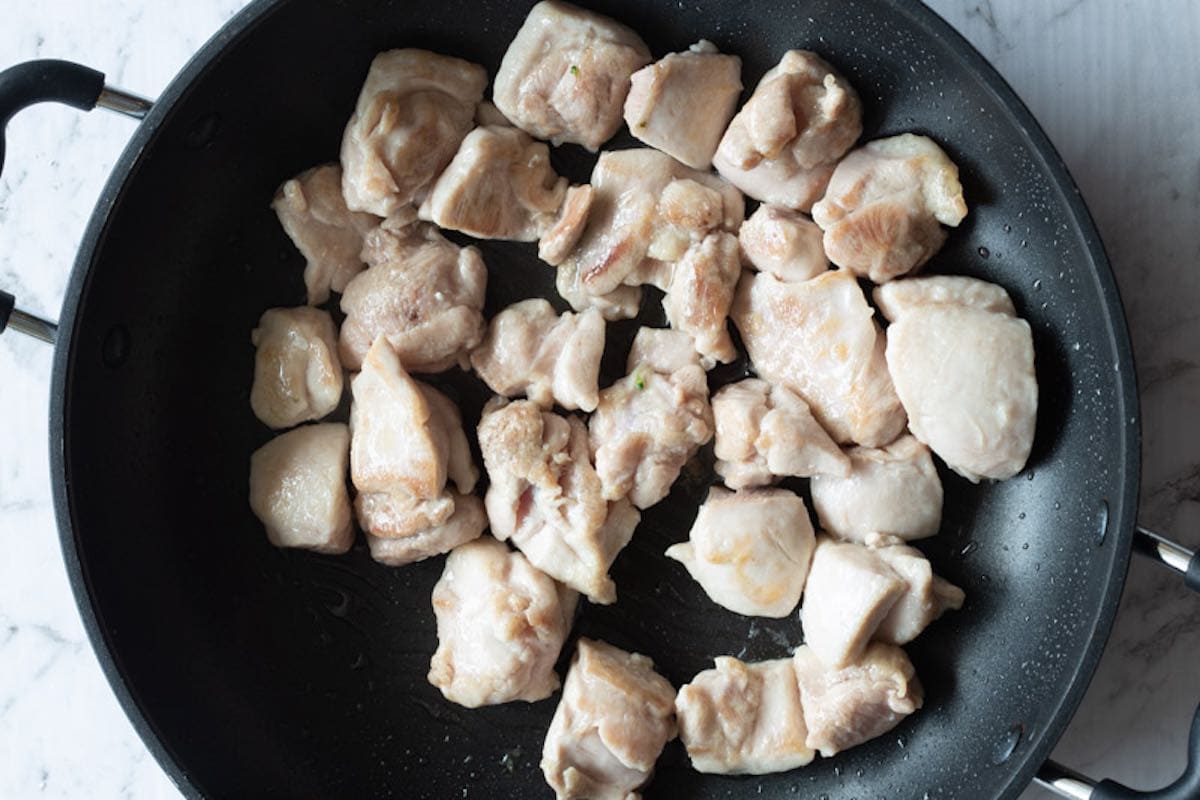 cooked chicken thighs in a skillet.