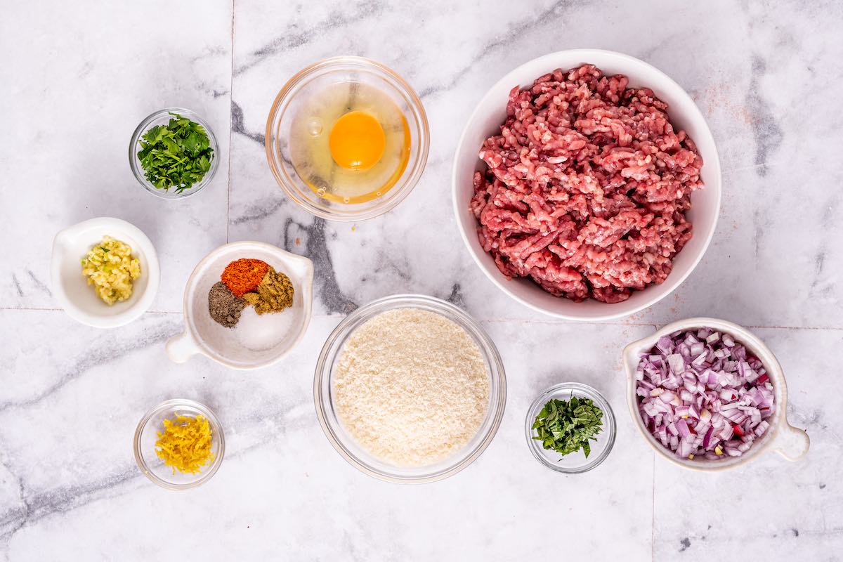 lamb meatball ingredients in bowls.