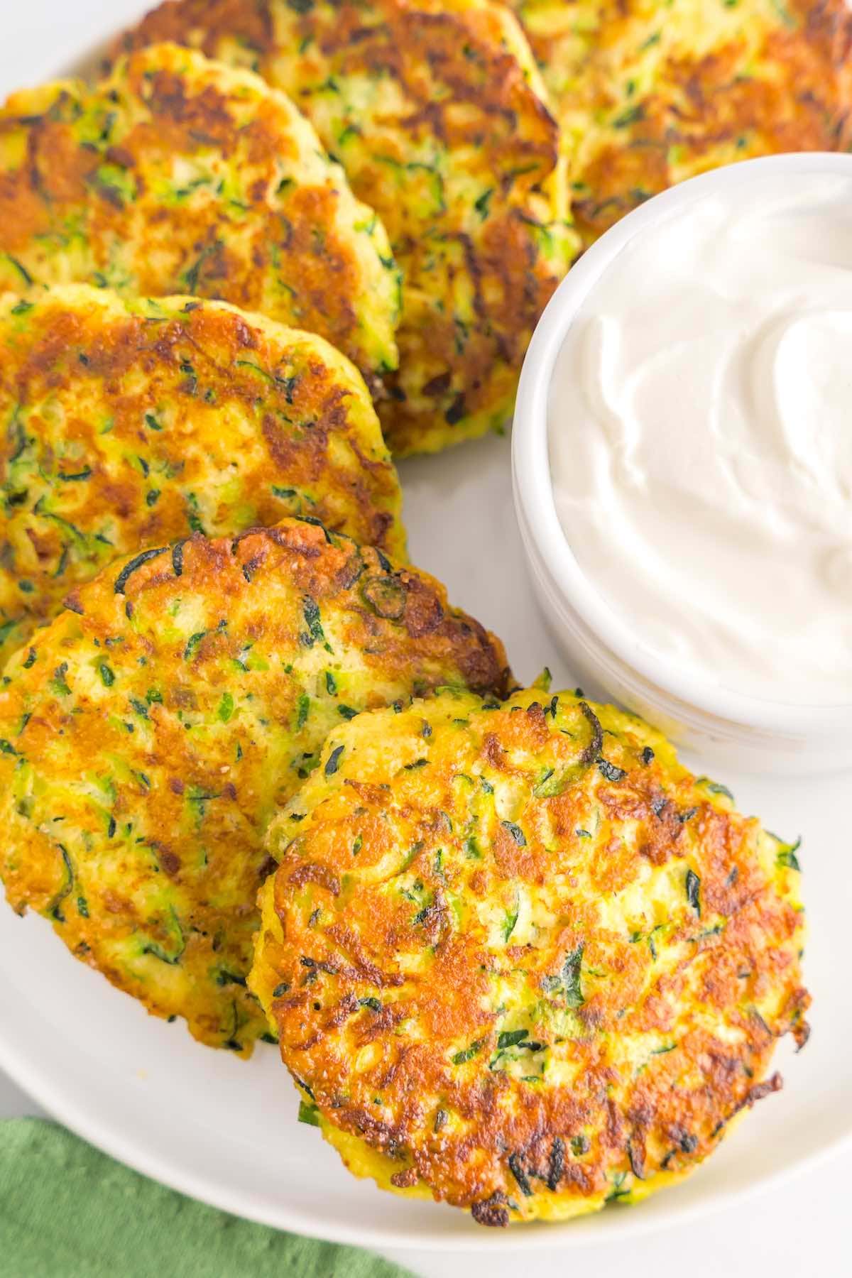 crispy zucchini fritters with yogurt sauce.