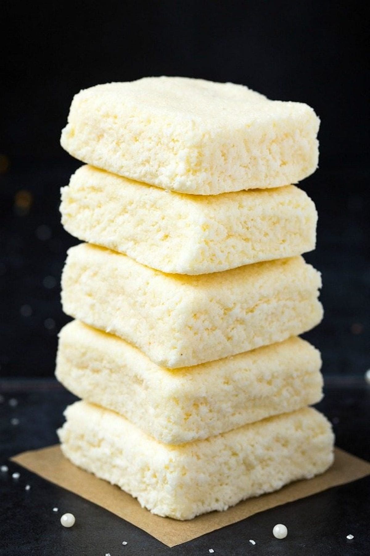 3 ingredient coconut bars stacked on top of one another.