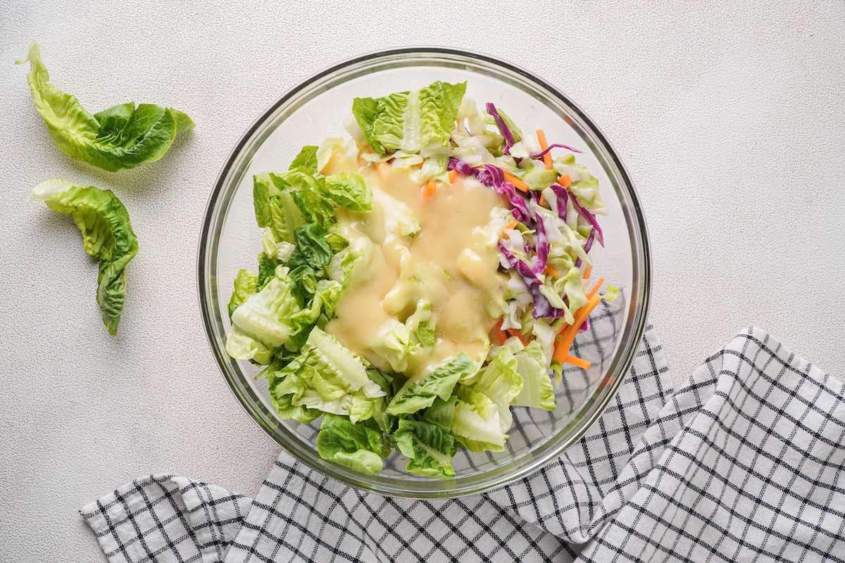 asian salad dressing over vegetables.