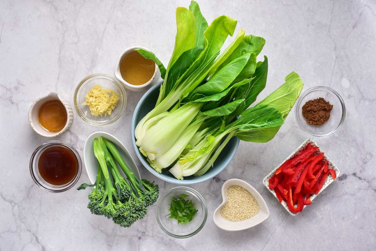 raw vegetables and seasonings in bowls.