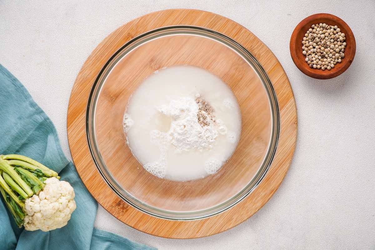 flour, milk, and seasonings in a bowl.