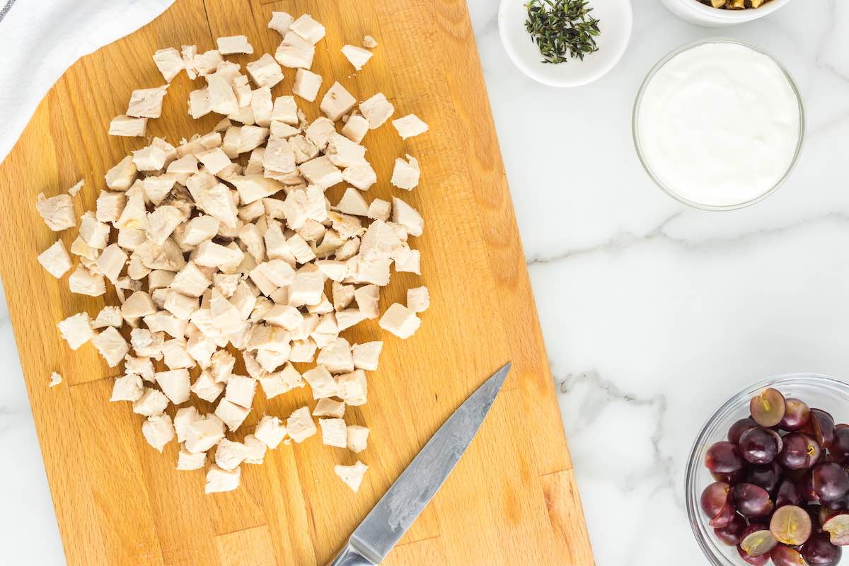 chopped chicken breast on a chopping board.