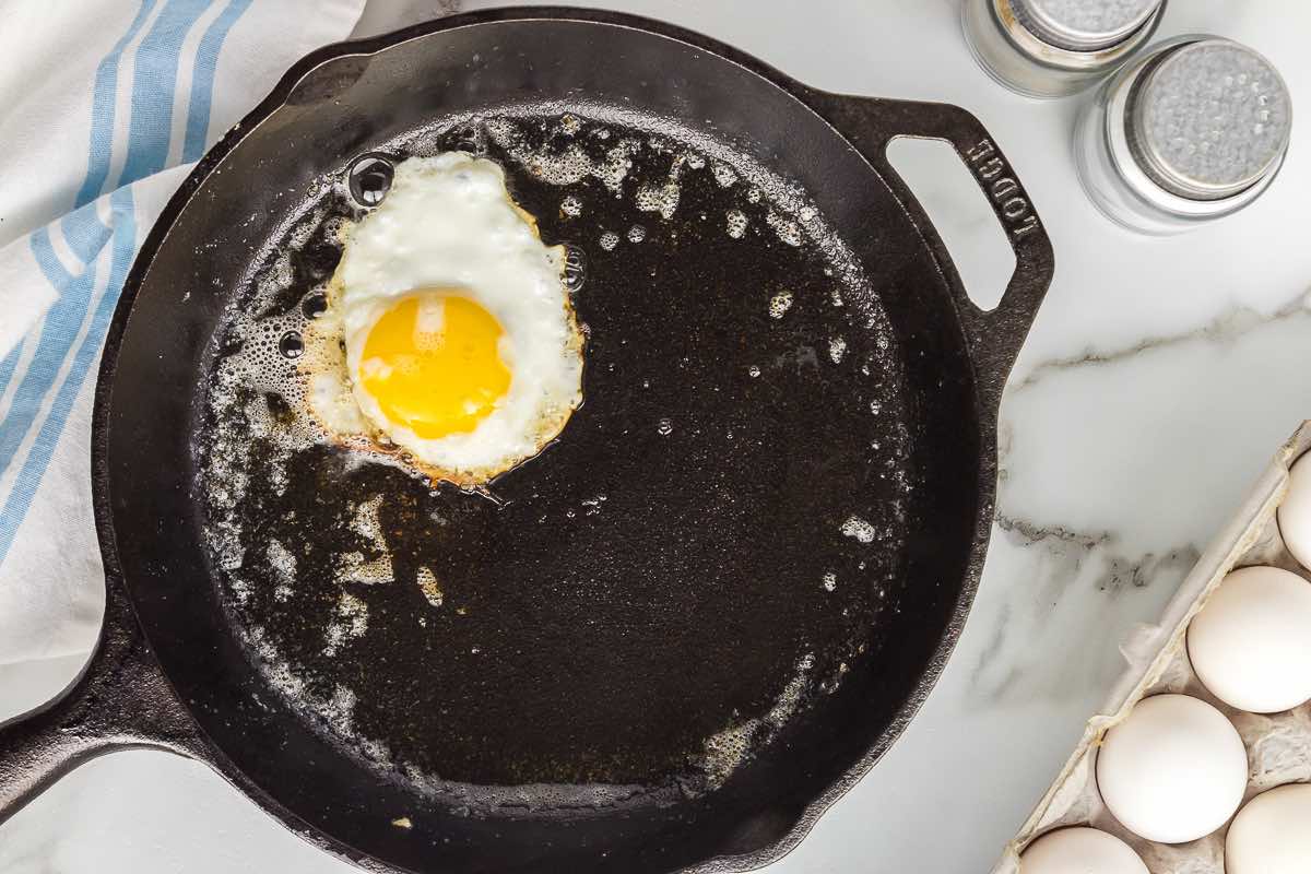 frying eggs in a skillet.