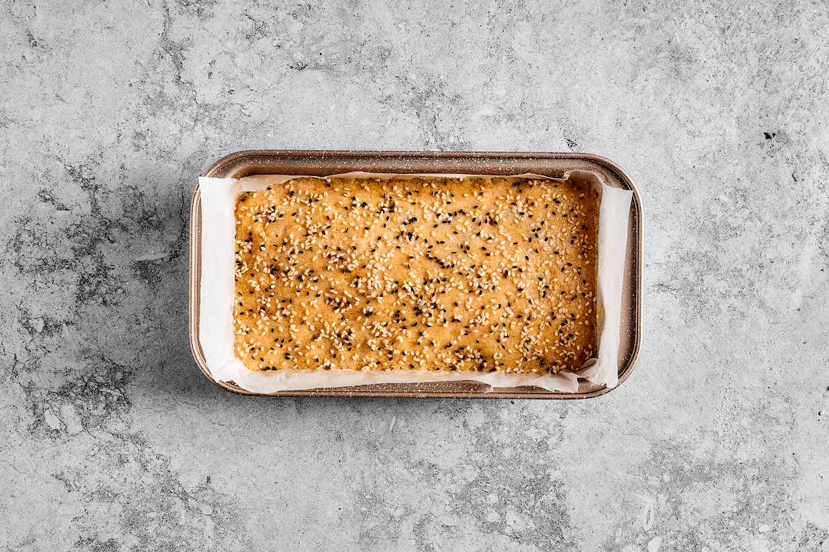 bread batter in a loaf pan.