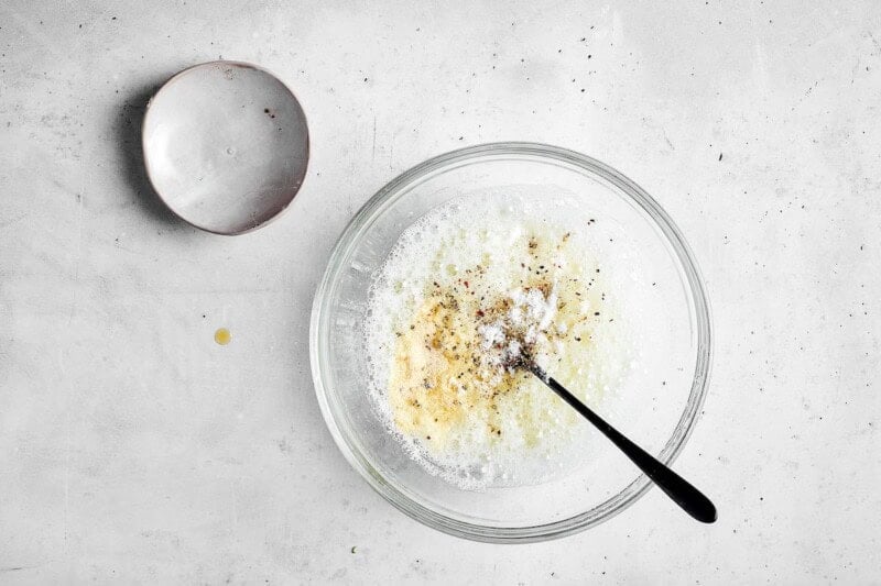 bowl with raw egg whites and seasonings.