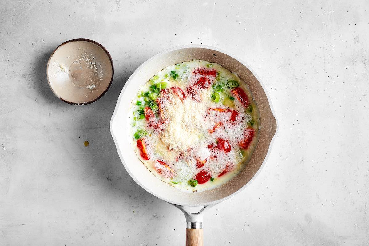 egg whites added to skillet with vegetables.