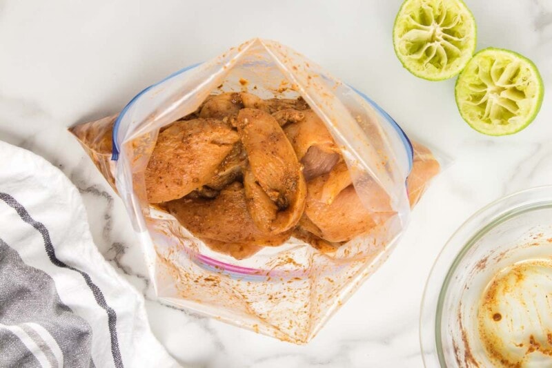 raw chicken in a ziplock bag with fajita seasoning.