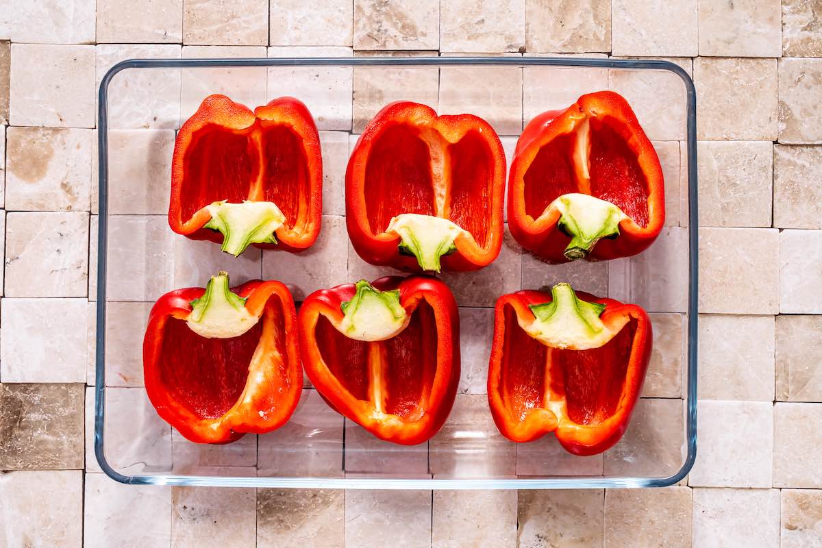 halved and hollowed out red peppers.