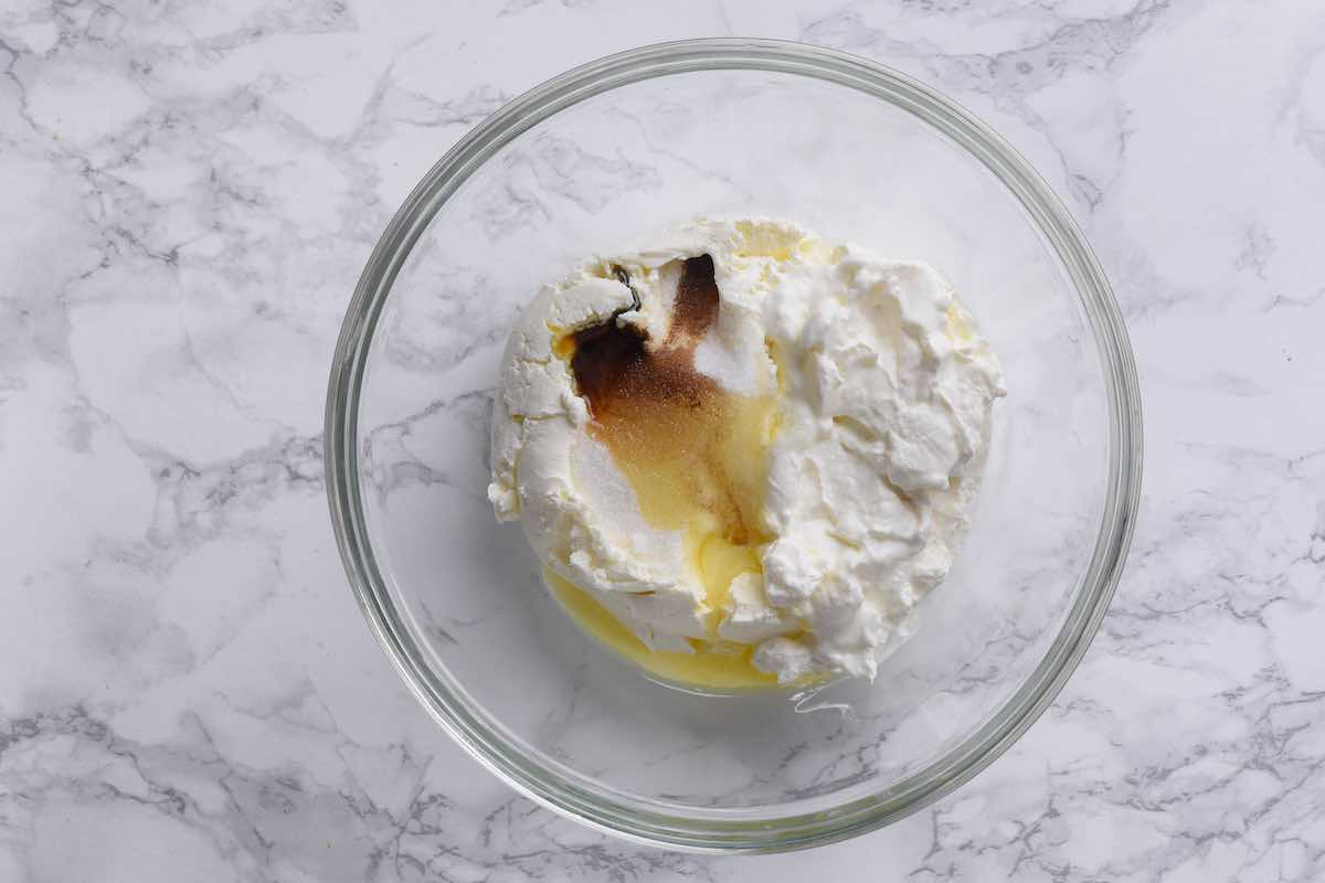 cream cheese, cinnamon, sugar, and melted butter in a bowl.